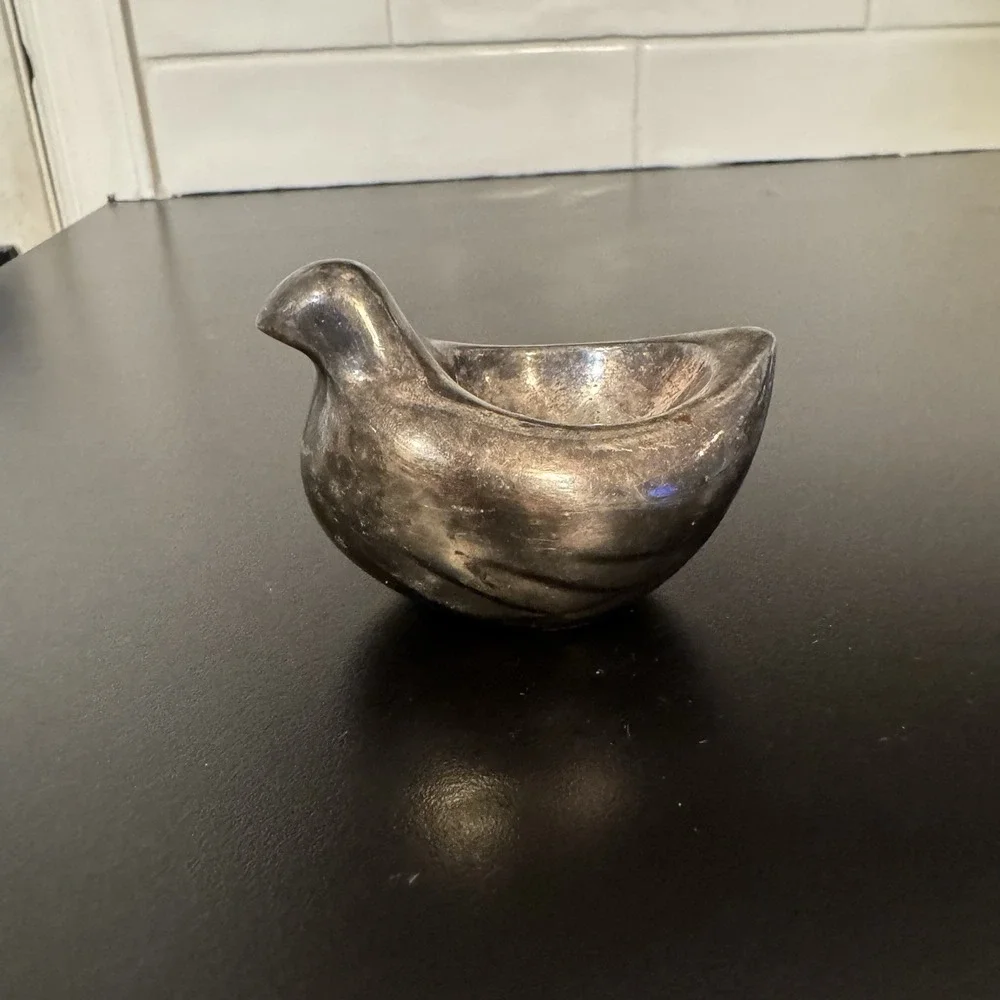 Pottery barn silver plated dove. Great as a ring or earring‎ holder.